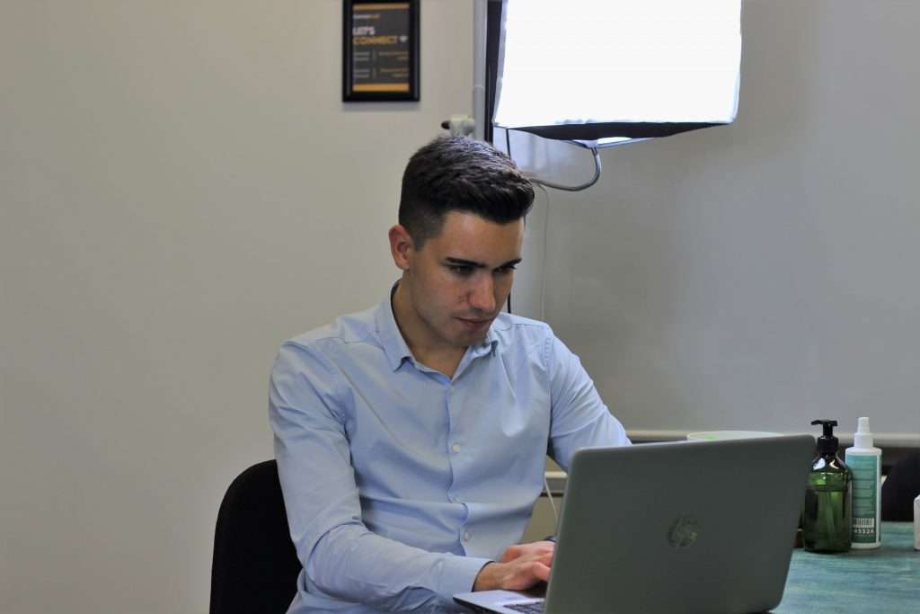 LeadGen App Co-Founder Christopher Lier working on his laptop