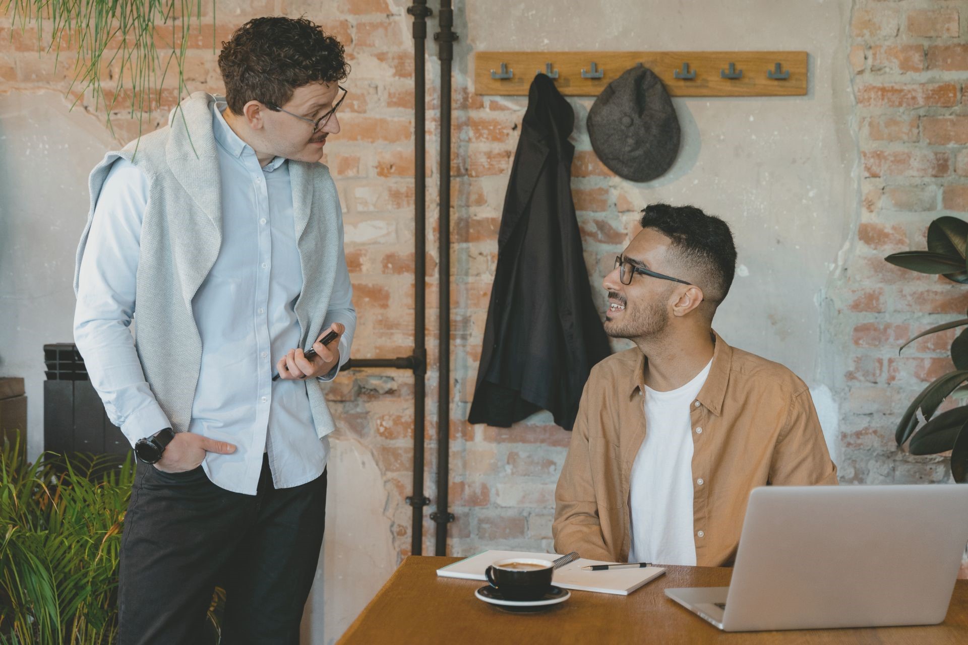 Two persons engaged in discussion