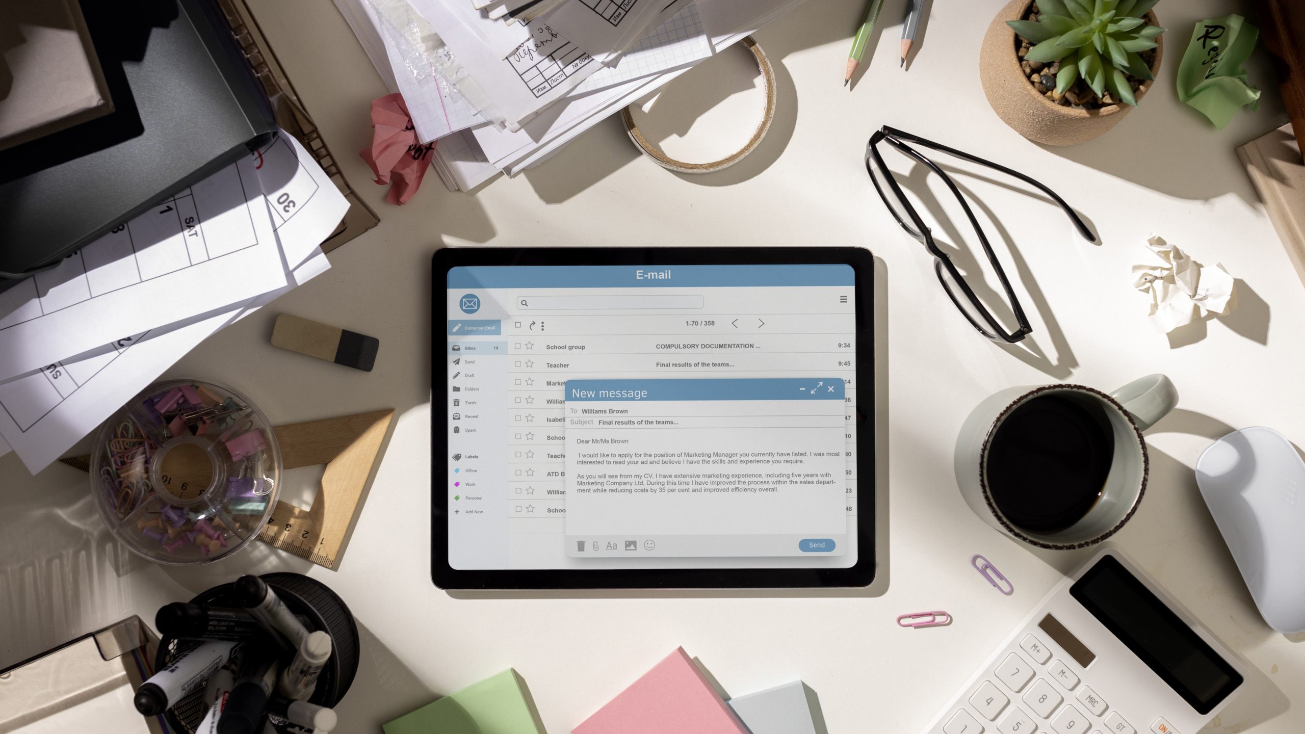 top-view-messy-office-workspace-with-tablet