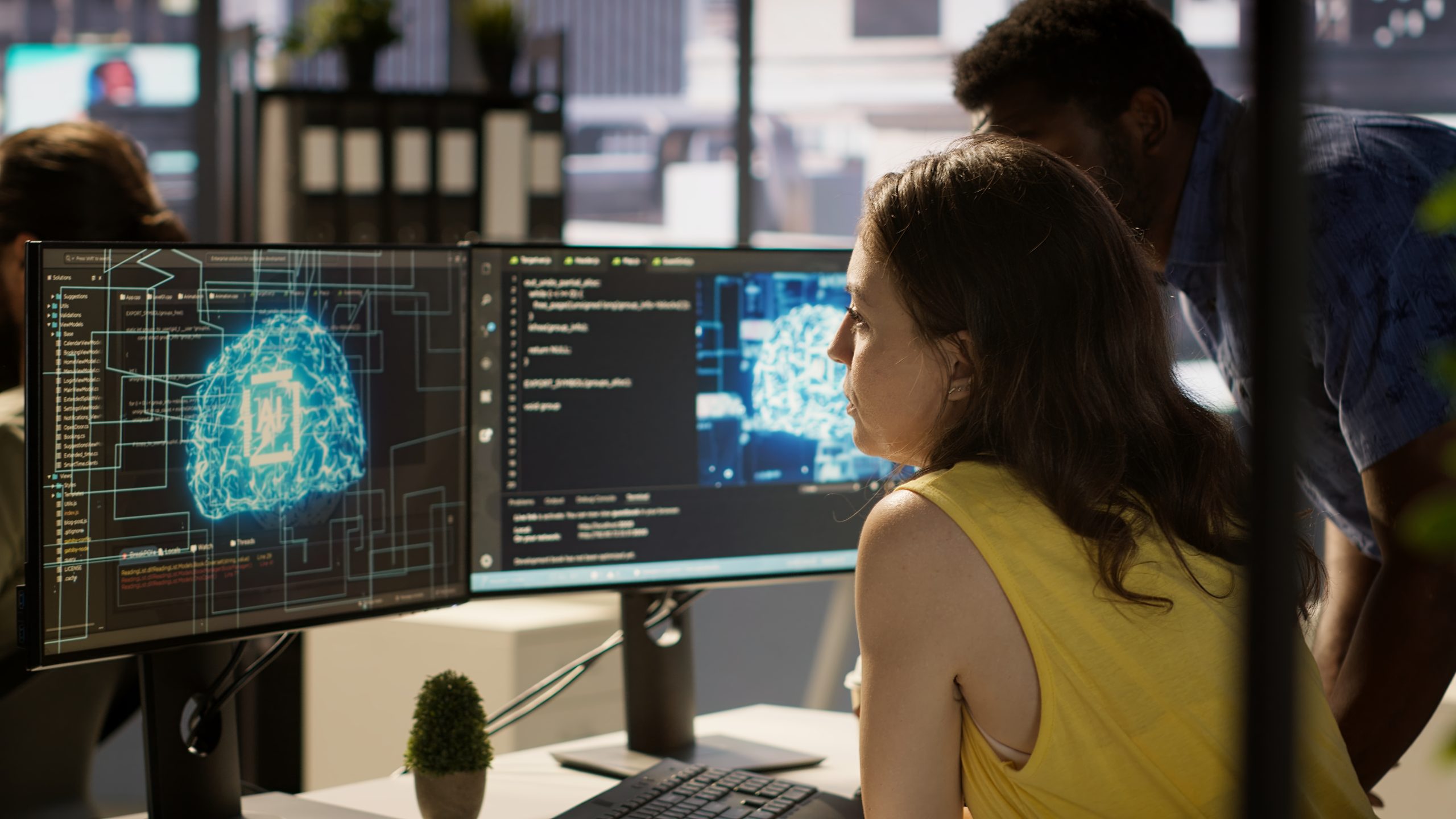 employee-using-ai-technology-design-machine-learning-algorithms-scaled.jpg